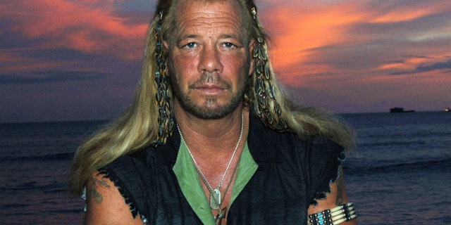 Jan. 10, 2006: This file photo shows bounty hunter Duane "Dog" Chapman star of the Hawaii-based reality show, "Dog the Bounty Hunter," on Waikiki Beach, in Honolulu.