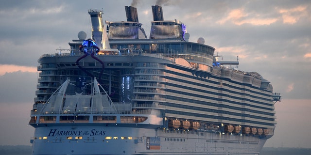 The world's largest passenger ship, Harmony of the Seas, owned by Royal Caribbean, docks on arrival in Southampton, England, Tuesday May 17, 2016, ahead of her maiden cruise. After 32-months being fitted out in a French shipyard the 16-deck Harmony of the Seas will set out on its inaugural voyage on May 22 bound for Barcelona, Spain. (Andrew Matthews/PA via AP) UNITED KINGDOM OUT - NO SALES - NO ARCHIVES