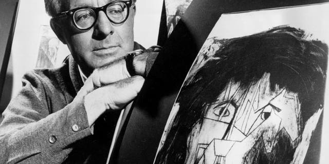 FILE - This Dec. 8, 1966 file photo shows science fiction writer Ray Bradbury looks at a picture that was part of a school project to illustrate characters in one of his dramas in Los Angeles. Bradbury, who wrote everything from science-fiction and mystery to humor, died Tuesday, June 5, 2012 in Southern California. He was 91.