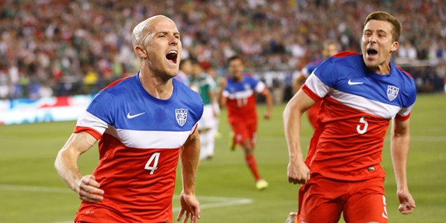 U.S. midfielder Michael Bradley, left, celebrates with defender Matt Besler (5) after scoring a goal against Mexico during the first half of an international friendly soccer match, Wednesday, April 2, 2014, in Glendale, Ariz. (AP Photo/The Arizona Republic, Michael Chow) MESA OUT  MARICOPA COUNTY OUT  MAGS OUT  NO SALES