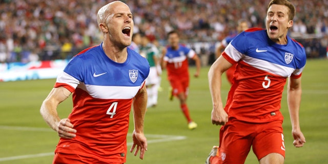 U.S. midfielder Michael Bradley, left, celebrates with defender Matt Besler (5) after scoring a goal against Mexico during the first half of an international friendly soccer match, Wednesday, April 2, 2014, in Glendale, Ariz. (AP Photo/The Arizona Republic, Michael Chow) MESA OUT MARICOPA COUNTY OUT MAGS OUT NO SALES