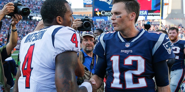 New England Patriots quarterback Tom Brady greets Houston Texans quarterback Deshaun Watson after their game in Foxborough, September 24, 2017.