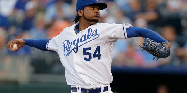 FILE - In this Aug. 20, 2013 file photo, Kansas City Royals starting pitcher Ervin Santana throws during the first inning of a baseball game against the Chicago White Sox, in Kansas City, Mo. The Atlanta Braves have signed Santana to bolster their injury plagued starting rotation. The team announced Wednesday, March 12, 2014, that Santana agreed to a one-year deal. (AP Photo/Charlie Riedel, File)