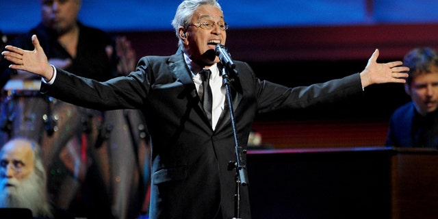 FILE - In this Nov. 15, 2012, file photo, Caetano Veloso performs at the 13th Annual Latin Grammy Awards at Mandalay Bay, in Las Vegas. Veloso is taking a shellacking from the press and his fan base alike, who say heâs endorsing censorship by leading the defense of a wide-ranging law that allows Brazilians to block or pull from the shelves any biographical work about them that was created without their consent. (AP Photo/Invision/Al Powers, File)
