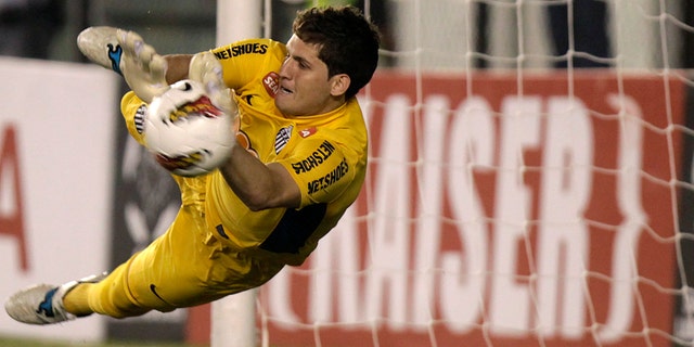May 24, 2012: In this file photo Brazil's Santos' goalkeeper Rafael stops a shot in the penalty shootout of a Copa Libertadores soccer match in Santos, Brazil.