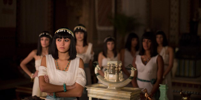 In this May 13, 2015 photo, Brazilian actresses wait backstage for their cue during the filming of the Brazilian prime-time soap opera, "The Ten Commandments" at a RecNov studio, in Rio de Janeiro, Brazil. Swathed in Egyptian cotton robes and sporting lapis lazuli jewelry and Cleopatra wigs, some of the characters are based on Biblical or other historic figures, while others are invented. (AP Photo/Leo Correa)