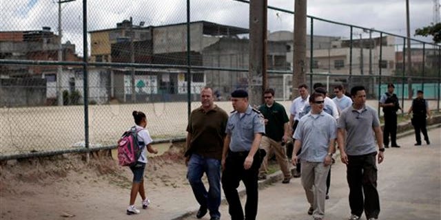 March 15: U.S. and Brazilian security officers inspect an area where President Barack Obama is expected to visit in the slum Cidade de Deus, or City of God, in Rio de Janeiro, Brazil. Obama is scheduled to visit Brazil on March 19 and 20 as part of a Latin American tour that also includes Chile and El Salvador. (AP)
