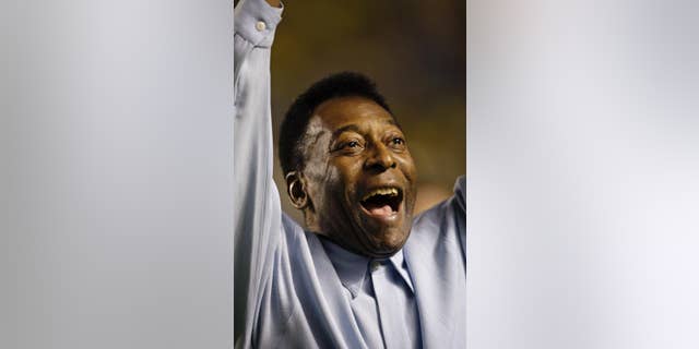 FILE - In this Nov. 19, 2008 file photo, Brazil's soccer great Pele greets supporters prior to a friendly soccer match, in Brasilia, Brazil. A Brazilian hospital says Pele has been transferred to a "special care" unit to be monitored while being treated for a urinary infection. The Albert Einstein hospital in Sao Paulo, said in a statement Thursday. Nov. 27, 2014, that the 74-year-old Pele was transferred to a quieter wing. (AP Photo/Silvia Izquierdo, File)