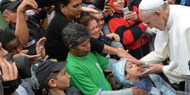 Pope Francis during his visit to the Varginha slum in Rio de Janeiro, Brazil, Thursday, July 25, 2013.