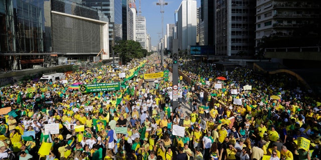 April 12, 2015: Demonstrators take part in an anti-government protest in Sao Paulo, Brazil. Anti-government demonstrators streamed into the streets throughout Brazil to demand the impeachment of President Dilma Rousseff. (AP Photo/Nelson Antoine)