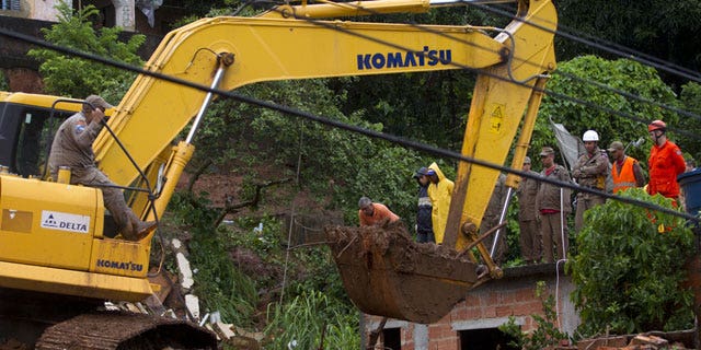 January 9, 2012: Rescue personnel work at the site of a mudslide that killed at least eight people in Jamapara, Rio de Janeiro state, Brazil.