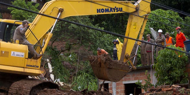 January 9, 2012: Rescue personnel work at the site of a mudslide that killed at least eight people in Jamapara, Rio de Janeiro state, Brazil.