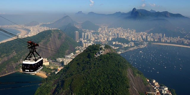 RIO DE JANEIRO, BRAZIL - JUNE 07: A view of the city as a cable car heads up Sugar Loaf Mountain ahead of the of FIFA Confederations Cup Brazil 2013 on June 7, 2013 in Rio de Janeiro, Brazil. (Photo by Michael Regan/Getty Images)