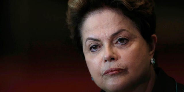 FILE - In this Oct. 6, 2014 file photo, Brazil's President Dilma Rousseff listens to a question during a re-election campaign news conference at the Alvorada Palace in Brasilia, Brazil. Just days after the Rio Olympics ended, Brazilian senators are now gearing up for a final decision on whether to permanently remove President Dilma Rousseff from office. The months-long leadership fight has brought to the surface deep polarization in Latin America's most populous nation, fueled by anger over endemic corruption and angst about an emerging economy that has gone from darling to depression amid its worst financial crisis in decades. (AP Photo/Eraldo Peres, File)