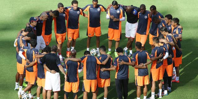 Costa Rica's players start a training session the day before their World Cup soccer match with Italy at the Arena Pernambuco stadium in Recife, Brazil, Thursday, June 19, 2014. (AP Photo/Antonio Calanni)