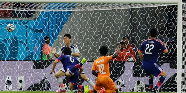 June 14, 2014: Ivory Coast's Wilfried Bony, (12), scores his side's first goal during the group C World Cup soccer match between Ivory Coast and Japan at the Arena Pernambuco in Recife, Brazil. (AP Photo/Shuji Kajiyama)