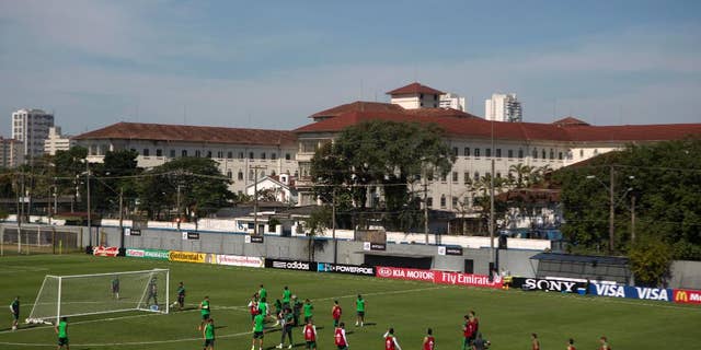 Mexico's national soccer team players train during a practice session in Santos, Brazil, Sunday, June 8, 2014. Mexico play in group A of the 2014 soccer World Cup. (AP Photo/Eduardo Verdugo)