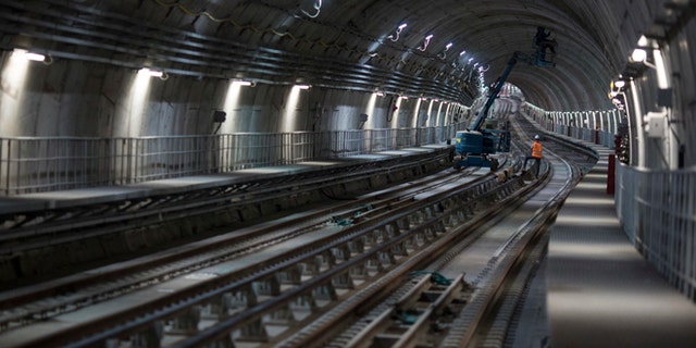Men work in the new underground subway tunnel below Ipanema neighborhood in Rio de Janeiro, Brazil.