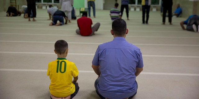 Syrian refugees attends prayer at a mosque in Sao Paulo, Brazil, Monday, May 25, 2015. Nearly 2,000 Syrians are trying to make a new life in Brazil, which has accepted more Syrians fleeing the violence at home than any other nation in the Americas with the exception of Canada. (AP Photo/Andre Penner)