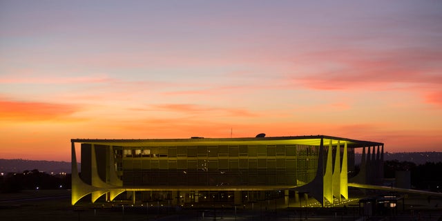 FILE - In this May 12, 2016, file photo, Planalto presidential palace during sunrise in Brasilia, Brazil, after the Senate voted to suspend President Dilma Rousseff pending an impeachment trial. For the sake of the nationâs 200 million people, and for all the South American nations whose fortunes are tied to Brazilâs powerhouse economy, one hopes that her vice president, now acting President, Michel Temer know what to do. (AP Photo/Felipe Dana)