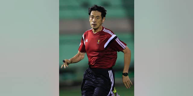 Referee Yuichi Nishimura from Japan runs during a referee's training session in Rio de Janeiro, Brazil, Friday, June 6, 2014. Brazil is hosting the World Cup soccer tournament that starts June 12. (AP Photo/Hassan Ammar)