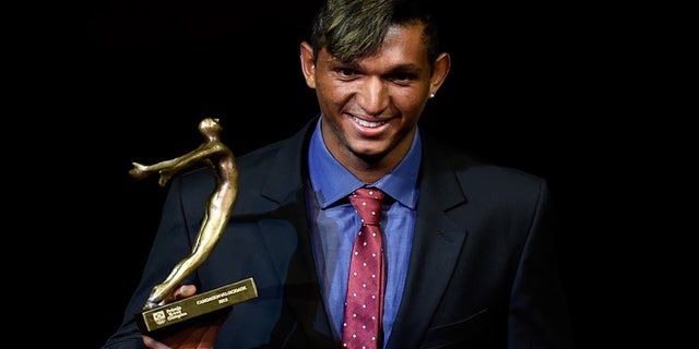 RIO DE JANEIRO, BRAZIL - DECEMBER 15: Brazilian Canoe Sprint competitor Isaquias Queiroz is awarded during the ceremony of Brazil's Olympics award Premio Brasil Olimpico at Bradesco Theater on December 15, 2015 in Rio de Janeiro, Brazil. (Photo by Buda Mendes/Getty Images)
