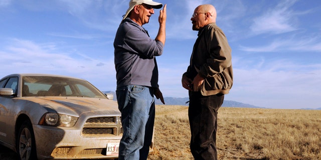 This 2012 photo released by AMC shows cinematographer Michael Slovis, left, and Bryan Cranston on the set of "Breaking Bad." The series finale will air on Sunday, Sept. 29. (AP Photo/AMC, Ursula Coyote)