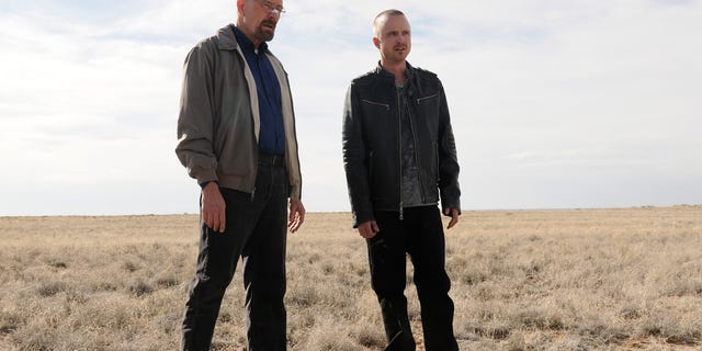 FILE - This file image released by AMC shows Bryan Cranston as Walter White, left, and Aaron Paul as Jesse Pinkman in a scene from the season 5 premiere of  "Breaking Bad."
