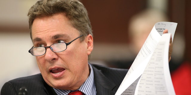 FILE - In this Wednesday, April 1, 2015, file photo, Nevada Assemblyman Brent Jones, R-Las Vegas, makes a presentation during a hearing at the Legislative Building in Carson City, Nev. A Catholic woman who was fired from her job at a bottled water company led by Jones filed a federal lawsuit against the business, alleging she was pressured to watch videos on Scientology and was denied pay raises because of her religious beliefs. (AP Photo/Cathleen Allison, File)