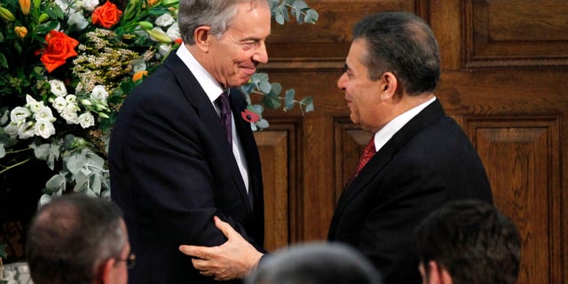 Former British Prime Minister Tony Blair, left talks to Mohammed J Al-Doreky, Iraq Deputy Foreign Minister after addressing the delegates, at the Iraq Britain Business Council (IBBC) fourth annual conference in central London, Monday, Nov. 5, 2012. Former Prime Minister Tony Blair says British forces should be proud of their role in the U.S.-led invasion of Iraq, citing what he claimed is major progress made in the country since the toppling of Saddam Hussein in 2003. (AP Photo/Sang Tan, Pool)