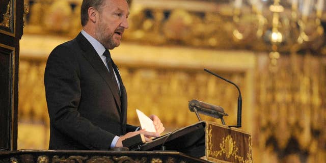 The Muslim Bosniak member of Bosnia's tripartite presidency Bakir Izetbegovic speaks during a memorial service at Westminster Abbey, London, to mark the upcoming 20th anniversary of the Srebrenica massacre Monday July 6, 2015. Days before anniversary of the Srebrenica massacre, hundreds of Bosnians and Britons attended the memorial service at Westminster Abbey on Monday to remember the more than 8,000 male Muslim victims. (Lauren Hurley/PA via AP) UNITED KINGDOM OUT