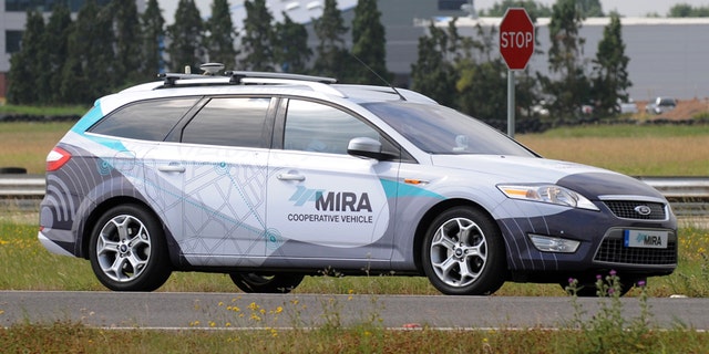 A driverless car during testing at the headquarters of motor industry research organization MIRA at Nuneaton in the West Midlands, England, Wednesday, July 30, 2014. British officials says driverless cars will be tested on roads in as many as three cities in a trial program to begin in January. Officials said Wednesday the tests will last up to three years. Sensors and cameras will guide the cars. (AP Photo/PA, Rui Vieira) UNITED KINGDOM OUT NO SALES NO ARCHIVE