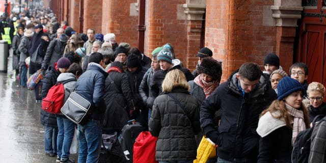 Passengers queue for Eurostar trains at St Pancras station in London, Tuesday, Dec. 21, 2010. Major delays and cancellations caused by cold and snow disrupted European airports including London's Heathrow, and the Eurostar train link, leaving thousands stranded across Europe as Christmas approached