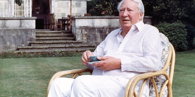 FILE - This is a July 19, 1989 file photo of former British Prime Minister Edward Heath as he takes tea in the garden of his home in Salisbury, England. (AP Photo/Martin Cleaver/File)