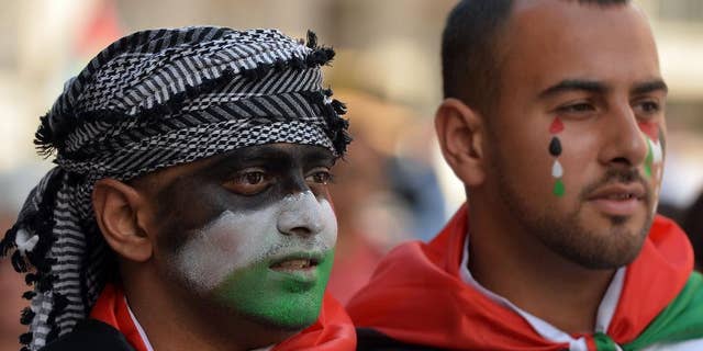Protesters against military action in Gaza gather by the BBC building in central London, Saturday, Aug. 9, 2014. Israeli airstrikes struck more than 20 targets Saturday in the Gaza Strip and killed a senior Hamas member, as militant rocket fire continued following the collapse of a three-day truce aimed at ending the war between Israel and Hamas. (AP Photo/John Stillwell, PA Wire) UNITED KINGDOM OUT - NO SALES - NO ARCHIVES