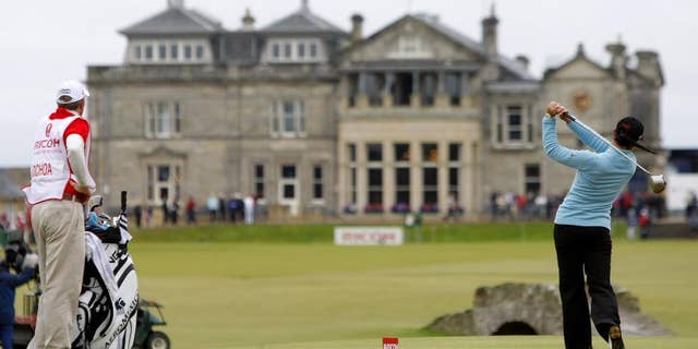 FILE - This is a Sunday, Aug. 5, 2007 file photo of tournament winner and world number one Mexico's Lorena Ochoa as she tees off from the 18th with the St Andrews clubhouse in the background, during the Women's British Open golf tournament on the Old Course at the Royal and Ancient Golf Club in St Andrews, Scotland. The Royal & Ancient could finally be allowing women to join one of the most influential golf clubs. The Daily Mail newspaper on Wednesday March 26, 2014 cited a letter from the R&A to its 2,500 members recommending they change the all-male membership policy at St. Andrews. (AP Photo/Matt Dunham, File)