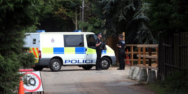 Aug. 27, 2012: Police stand at Earls Hall Farm in St Osyth, southern England where a lion was apparently seen.