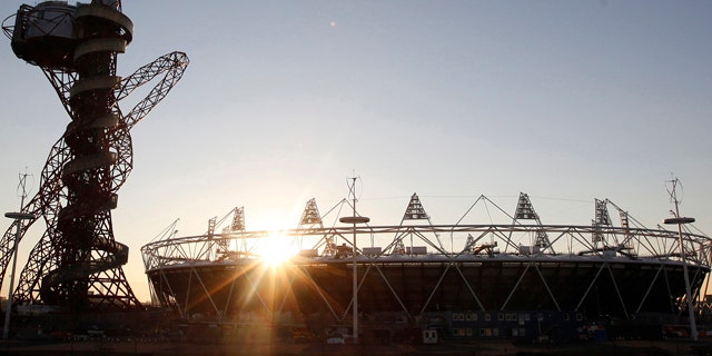 Feb. 23, 2012: In this file photo the London 2012 Olympic Stadium is seen at about sunset, with the partially completed ArcelorMittal Orbit at the Olympic Park in London.