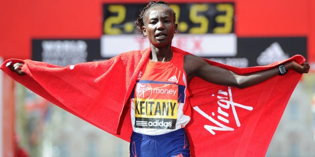 April 22, 2012: Kenya's Mary Keitany celebrates winning the women's race during the 2012 London Marathon for the second year during the 32nd London Marathon in London.