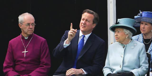 Seated near the Magna Carta memorial at Runnymede, England, are from left, The Archbishop of Canterbury Justin Welby, Prime Minister David Cameron, and Queen Elizabeth II.