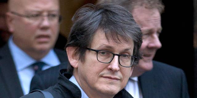 FILE - This Dec. 4, 2012 file photo shows Guardian newspaper editor Alan Rusbridger in London. Rusbridger the editor-in-chief of The Guardian newspaper said Wednesday Dec. 10, 2014, he will step down after 20 years in the role. Rusbridger said he would take over as chairman of The Scott Trust, which owns Guardian Media Group and was created to safeguard its journalistic freedom. Rusbridger’s leadership saw the paper expand from a Britain-only newspaper to an international media organization with a strong web presence. (AP Photo/Alastair Grant, File)