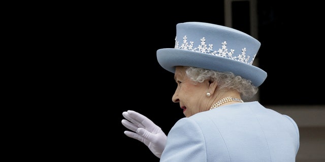 June 26, 2012: Britain's Queen Elizabeth II waves to the public as she arrives for a Service of Thanksgiving in Saint Macartin's Cathedral in Enniskillen, Northern Ireland.