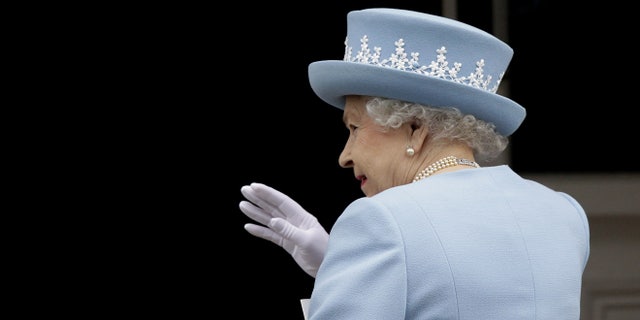 June 26, 2012: Britain's Queen Elizabeth II waves to the public as she arrives for a Service of Thanksgiving in Saint Macartin's Cathedral in Enniskillen, Northern Ireland.