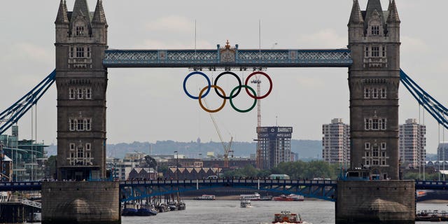 June 27, 2012:This file photo shows the Olympic rings atop the iconic Tower Bridge over the river Thames in London, with one month to go until the start of London 2012 Games.