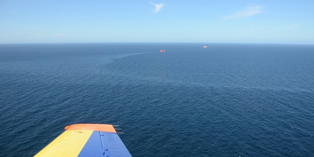 Aug. 17, 2011: In this image released by Scotland's government marine surveillance agency, a sheen of leaked oil can be seen off the east coast of the country. Royal Dutch Shell has shut down the main leak at one of its North Sea oil rigs but struggled Tuesday to repair a secondary spill in a hard to reach part of the ocean floor.