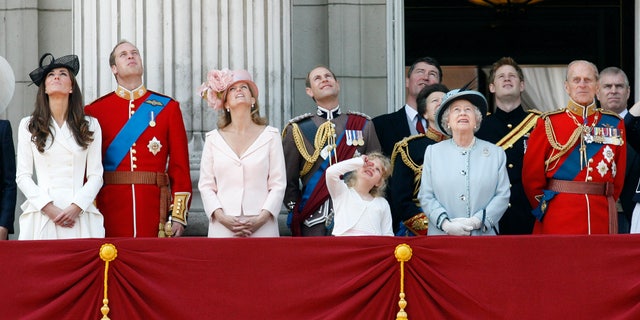 June 11, 2011: Britain's Duchess of Cambridge, Prince William the Duke of Cambridge, Countess of Wessex Sophie, Prince Edward the Earl of Wessex, their daughter Louise, Princess Anne, partially seen, her husband Tim Lawrence, Britain's Queen Elizabeth II, Prince Harry, Prince Philip the Duke of Edinburgh, and Prince Andrew, watch a Royal Air Force flypast on the balcony of Buckingham Palace.