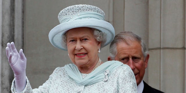 Queen Elizabeth waves from the balcony at Buckingham Palace during the Diamond Jubilee celebrations in central London, in a June 2012 image. 