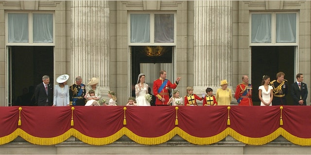 Britain's Prince William, center right, stands on the balcony of Buckingham Palace with his wife, Kate, the Dutchess of Cambridge, center left, and other royals after the Royal Wedding in London on Friday, April, 29, 2011.