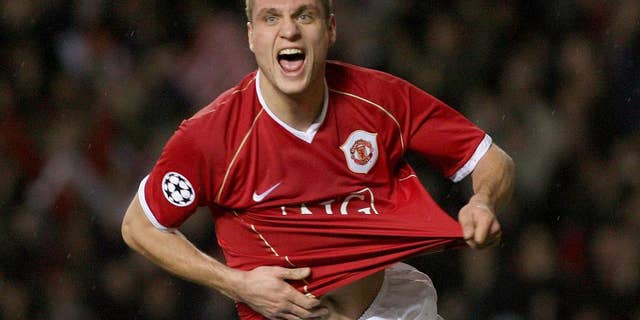 FILE - This is a Wednesday Dec. 6, 2006 file photo of Manchester United's Nemanja Vidic as he celebrates scoring against Benfica during their Group F Champions League soccer match at Old Trafford, Manchester, England. Inter Milan said Wednesday March 5, 2014 Manchester United defender Nemanja Vidic will join the club for the start of next season. (AP Photo/Steven Governo, File)