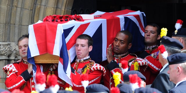 July 12, 2013 - The coffin of murdered Fusilier Lee Rigby is carried by soldiers after his funeral service at Bury Parish church in Greater Manchester, England. Relatives of the British soldier killed in broad daylight by alleged Islamic extremists say they are deeply grateful for the support they have received from the public. Rigby was hacked to death May 22 on a London street near his army barracks.